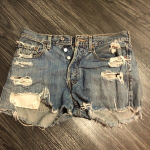 Distressed Levi’s denim shorts.